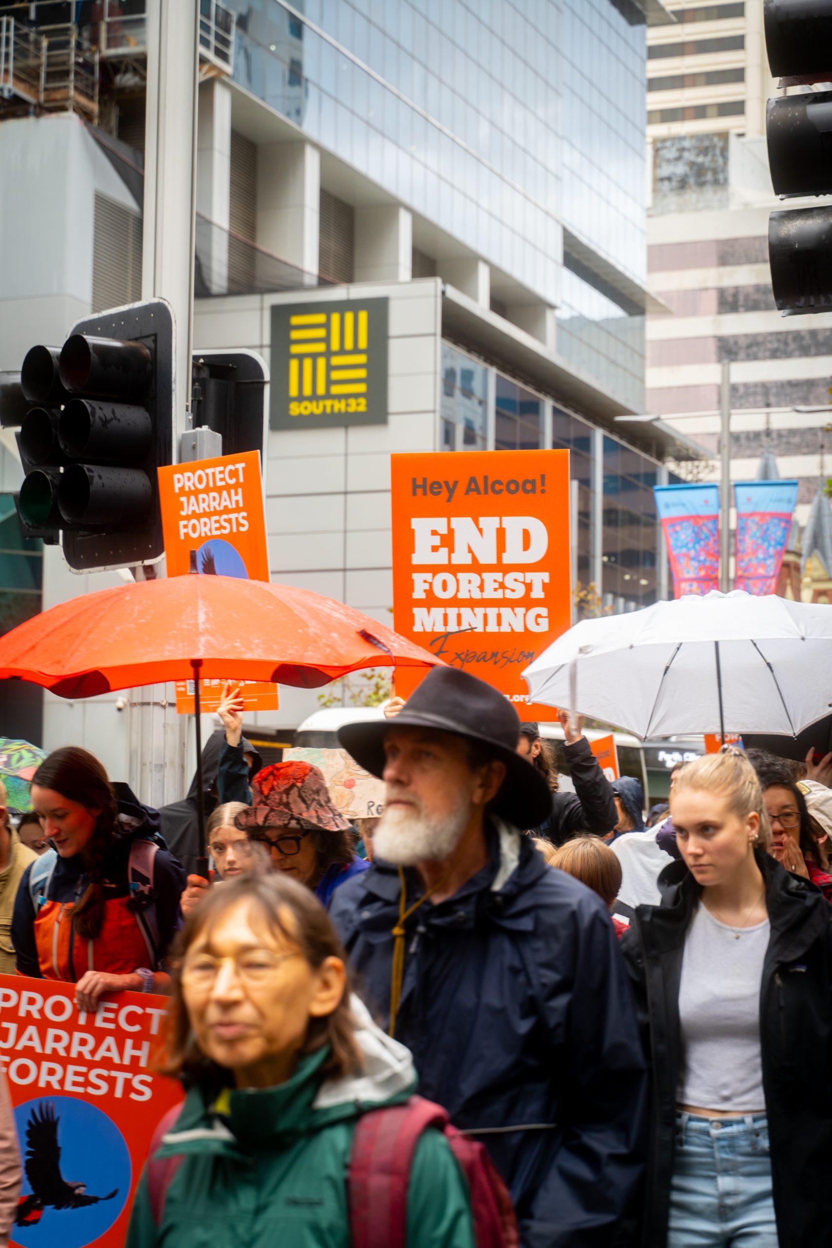 Big Jarrah Rally-ers outside the South32 building in Perth CBD, walking towards parliament house